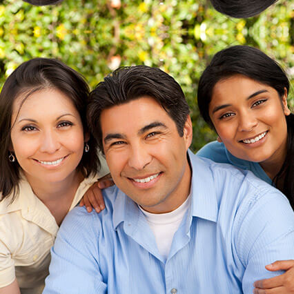 family of three smiling